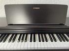 Yamaha Arius YDP-105 Traditional Console Digital Piano With Bench Dark Rosewood Used. Price: $755.00.