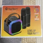 Toptech Bluetooth Portable Karaoke System, Rechargeable, Led Lights, 2 Mics New. Price: $17.00.