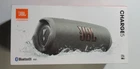 (JBLCHARGE5GRYAM) Portable Speaker System - Grey Used. Price: $136.55.